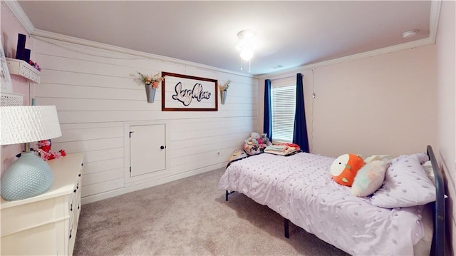 carpeted bedroom featuring ornamental molding