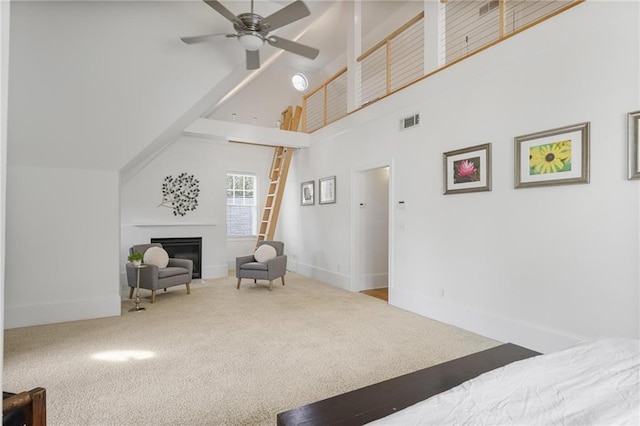 101 Terrace Dr, Atlanta, GA 30305 - bedroom featuring high vaulted ceiling, carpet, baseboards, a glass covered fireplace, and a ceiling fan
