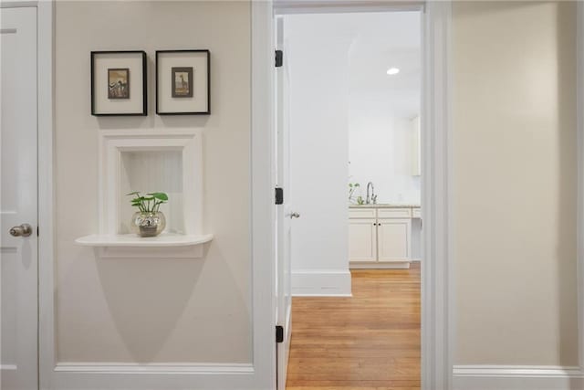 101 Terrace Dr, Atlanta, GA 30305 - hallway featuring light wood finished floors, a sink, and baseboards