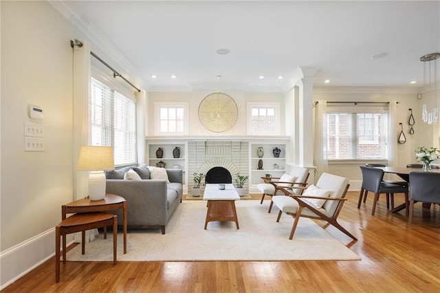 101 Terrace Dr, Atlanta, GA 30305 - living area with baseboards, crown molding, light wood-style floors, ornate columns, and a fireplace