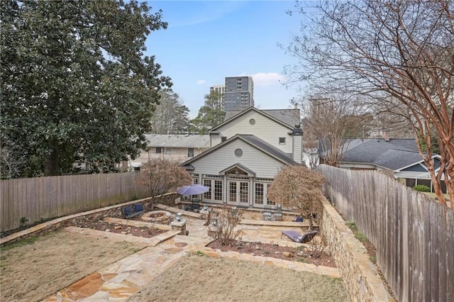 101 Terrace Dr, Atlanta, GA 30305 - rear view of property featuring a chimney, a fenced backyard, a patio, and french doors