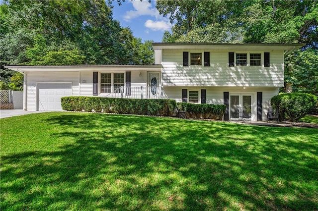 2621 Pass Cir, Gainesville, GA 30506 - split level home with french doors, a garage, a front lawn, and concrete driveway
