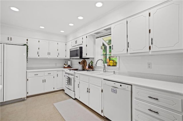 2621 Pass Cir, Gainesville, GA 30506 - kitchen featuring white appliances, a sink, white cabinets, recessed lighting, and light countertops