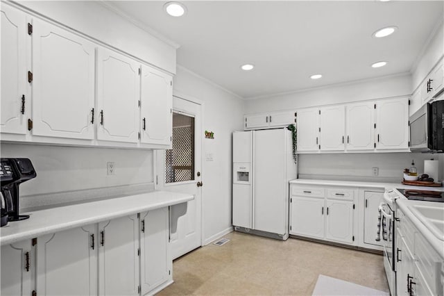 2621 Pass Cir, Gainesville, GA 30506 - kitchen with white fridge with ice dispenser, stainless steel microwave, electric stove, white cabinets, and recessed lighting