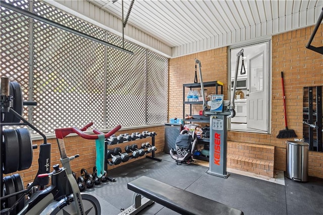 2621 Pass Cir, Gainesville, GA 30506 - exercise room featuring brick wall