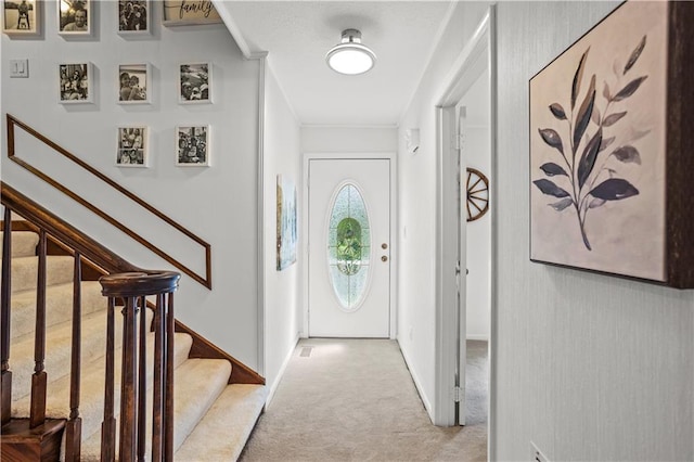 2621 Pass Cir, Gainesville, GA 30506 - foyer with light colored carpet, stairs, crown molding, and baseboards
