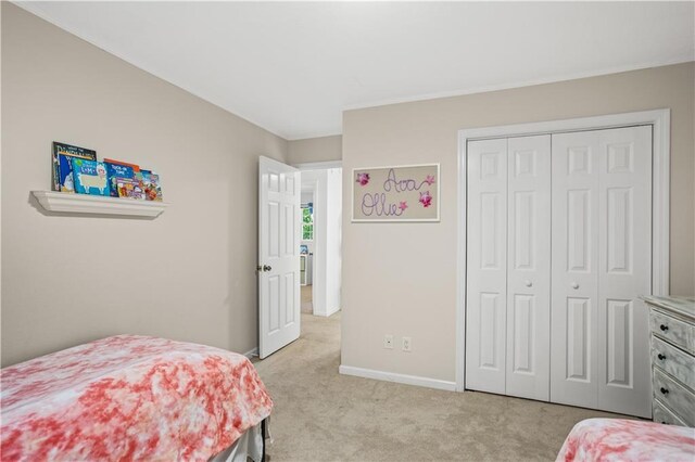 2621 Pass Cir, Gainesville, GA 30506 - bedroom with light carpet, baseboards, a closet, and crown molding