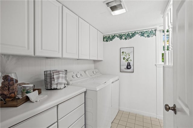 2621 Pass Cir, Gainesville, GA 30506 - washroom featuring cabinet space, washing machine and clothes dryer, light tile patterned flooring, and baseboards