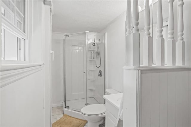 2621 Pass Cir, Gainesville, GA 30506 - full bathroom with a shower stall, a textured ceiling, toilet, vanity, and tile patterned flooring