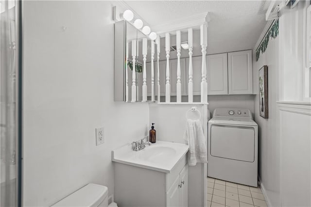 2621 Pass Cir, Gainesville, GA 30506 - bathroom featuring washer / clothes dryer, toilet, vanity, tile patterned floors, and a textured ceiling