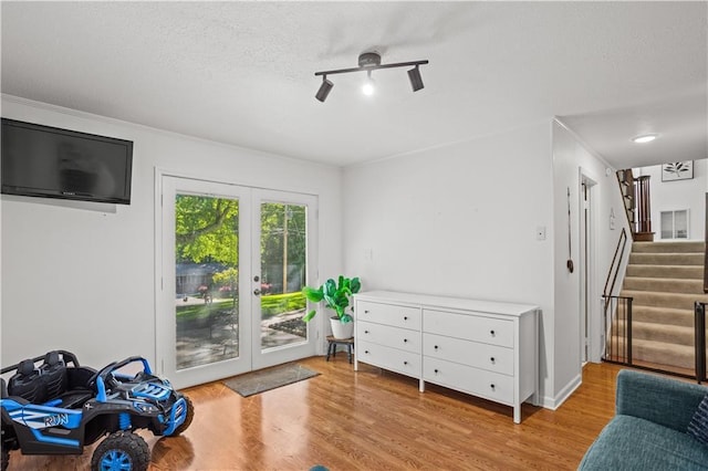 2621 Pass Cir, Gainesville, GA 30506 - sitting room with ceiling fan, french doors, stairway, wood finished floors, and crown molding