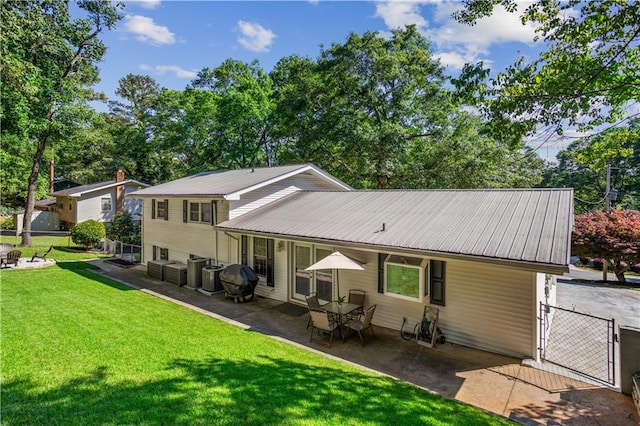 2621 Pass Cir, Gainesville, GA 30506 - back of house featuring metal roof, a patio area, and a gate