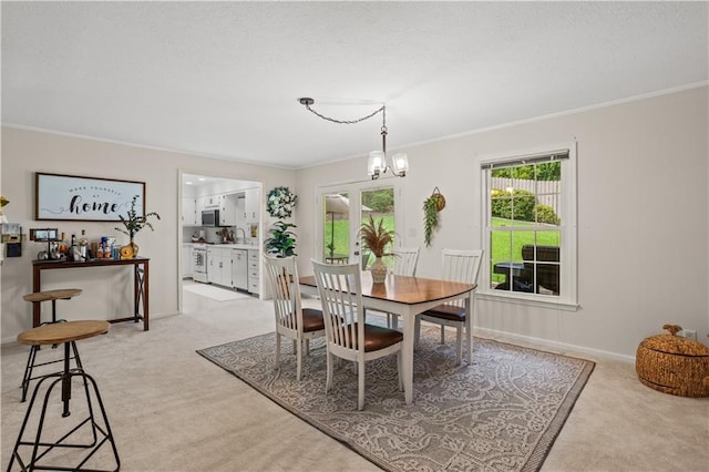2621 Pass Cir, Gainesville, GA 30506 - dining room with light carpet, ornamental molding, a chandelier, a textured ceiling, and baseboards