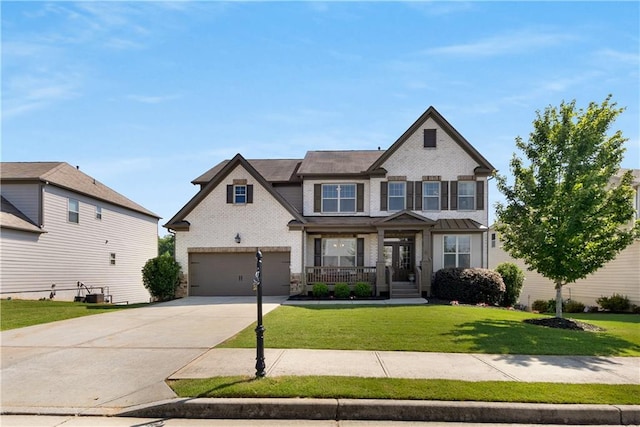 5240 Bristlecone Pine Way, Cumming, GA 30040 - craftsman inspired home with brick siding, driveway, a garage, and a front lawn