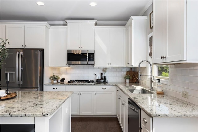5240 Bristlecone Pine Way, Cumming, GA 30040 - kitchen with appliances with stainless steel finishes, white cabinets, recessed lighting, backsplash, and light stone countertops