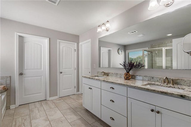 5240 Bristlecone Pine Way, Cumming, GA 30040 - bathroom with double vanity, a shower stall, and a bath