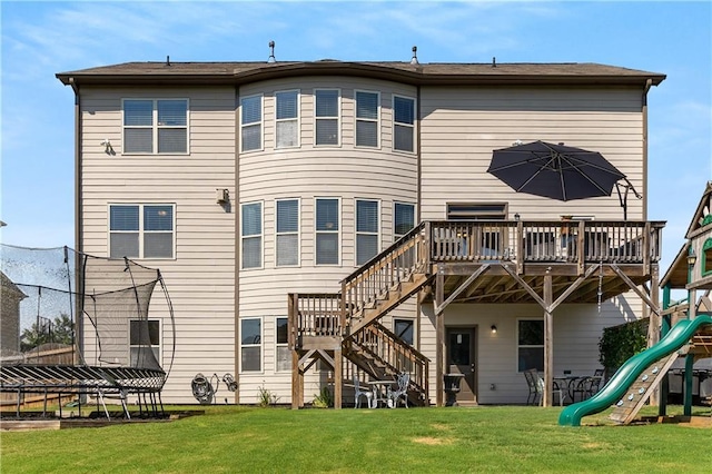 5240 Bristlecone Pine Way, Cumming, GA 30040 - back of house featuring stairway, a playground, a deck, a lawn, and a trampoline
