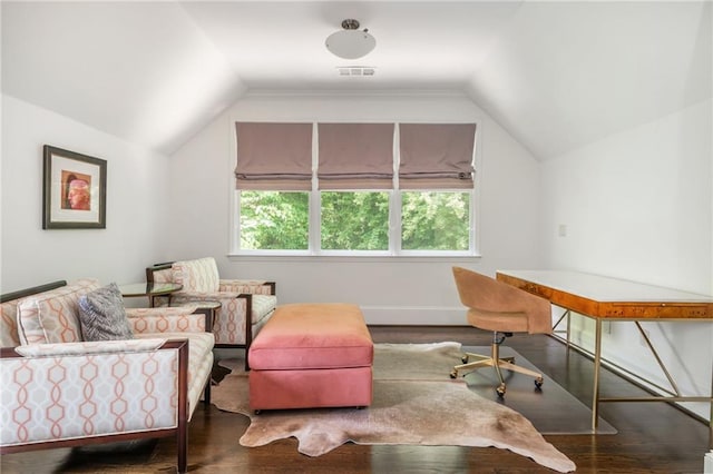 office space featuring lofted ceiling, wood finished floors, and baseboards