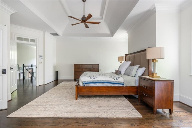 bedroom with dark wood-style floors, ornamental molding, baseboards, a ceiling fan, and lofted ceiling