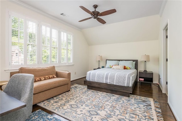 bedroom with multiple windows, wood finished floors, baseboards, ceiling fan, and vaulted ceiling