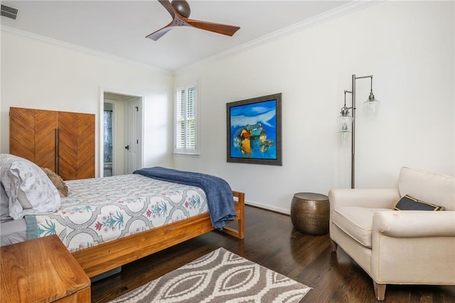 bedroom with ornamental molding, wood finished floors, baseboards, and ceiling fan