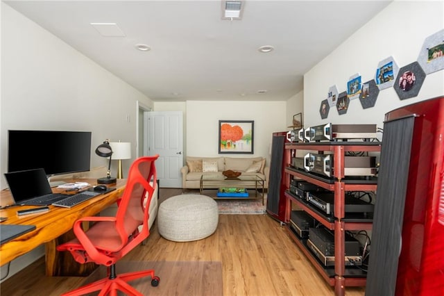 office space with wood finished floors and recessed lighting