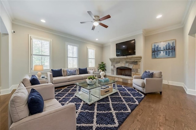 living room with hardwood / wood-style floors, crown molding, and a wealth of natural light