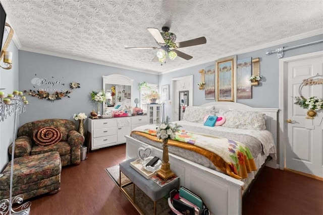 bedroom with crown molding, dark wood finished floors, a textured ceiling, and a ceiling fan