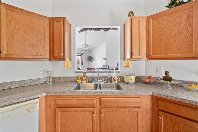 kitchen with white dishwasher, a sink, ceiling fan, and light countertops