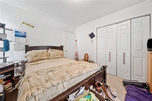 bedroom with a closet and a textured ceiling