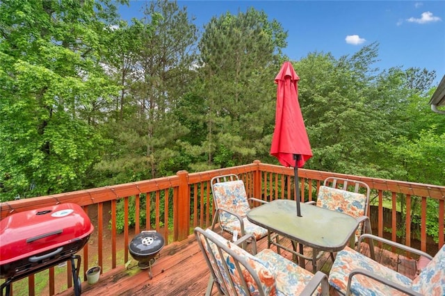wooden deck with outdoor dining area