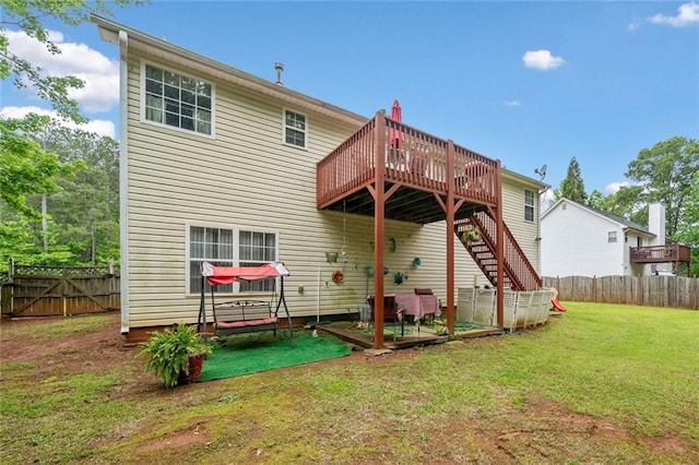 back of house with a wooden deck and stairs