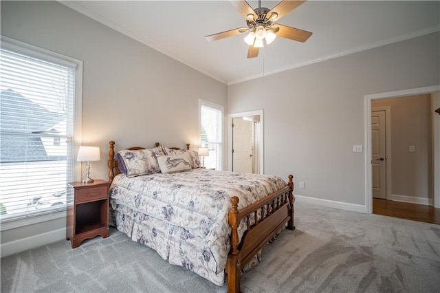 bedroom with light carpet, baseboards, ornamental molding, and a ceiling fan