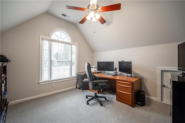 carpeted office with vaulted ceiling, a ceiling fan, and baseboards