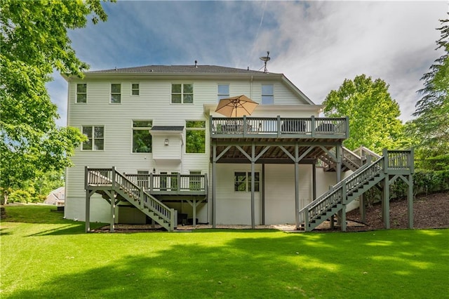 back of property featuring stairway, a deck, and a yard