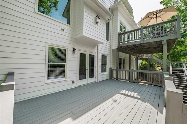 wooden terrace featuring french doors and stairway