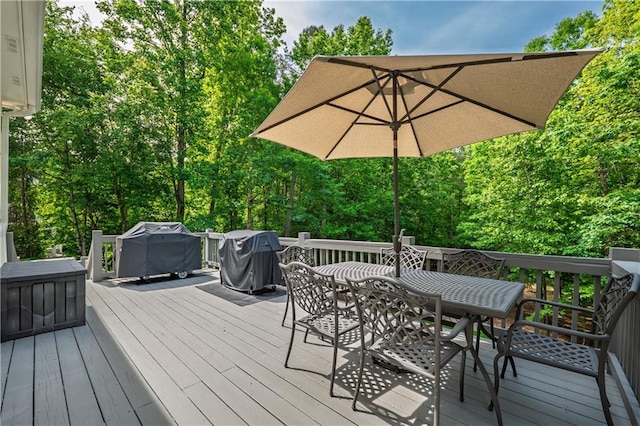 wooden terrace featuring outdoor dining area