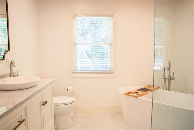 3050 Baymount Dr, Lawrenceville, GA 30043 - bathroom featuring double vanity, a freestanding tub, and tile patterned floors