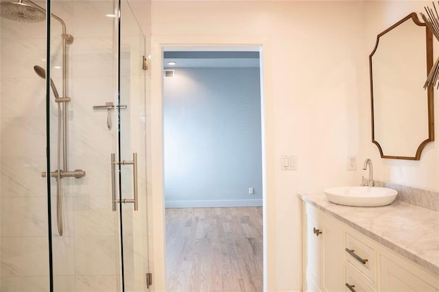 3050 Baymount Dr, Lawrenceville, GA 30043 - full bath with a shower stall, vanity, and wood finished floors