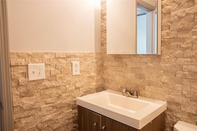 3050 Baymount Dr, Lawrenceville, GA 30043 - bathroom with vanity and tile walls