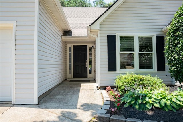 3050 Baymount Dr, Lawrenceville, GA 30043 - doorway to property featuring roof with shingles and an attached garage