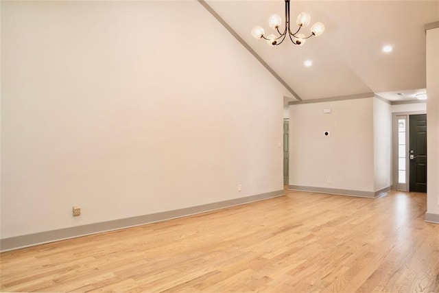 3050 Baymount Dr, Lawrenceville, GA 30043 - unfurnished living room with crown molding, vaulted ceiling, light wood-style floors, a chandelier, and recessed lighting