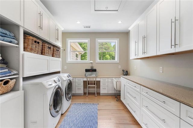 washroom featuring recessed lighting, washer and clothes dryer, cabinet space, and light wood-style flooring
