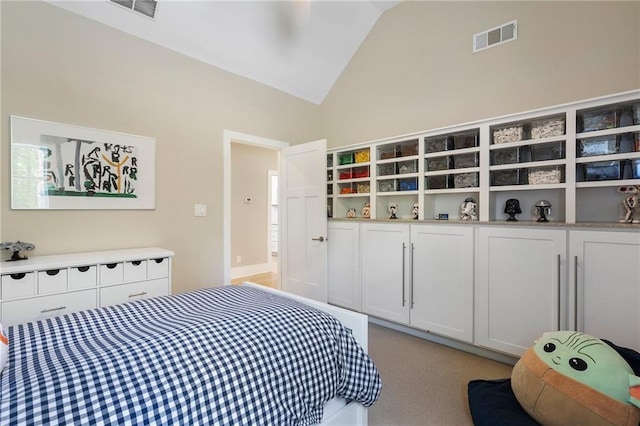 bedroom with visible vents and vaulted ceiling