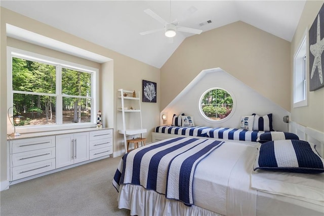 bedroom featuring lofted ceiling, light carpet, a ceiling fan, and visible vents