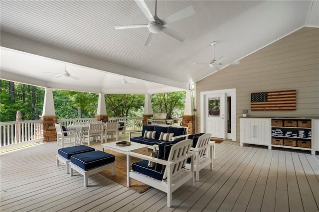 wooden terrace featuring a ceiling fan, outdoor dining area, and outdoor lounge area
