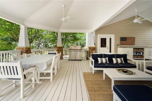 deck featuring an outdoor living space, a ceiling fan, outdoor dining area, and a grill