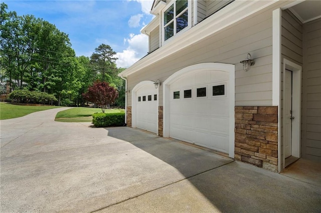 garage with concrete driveway