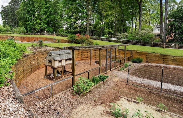 surrounding community featuring an outbuilding, exterior structure, and fence
