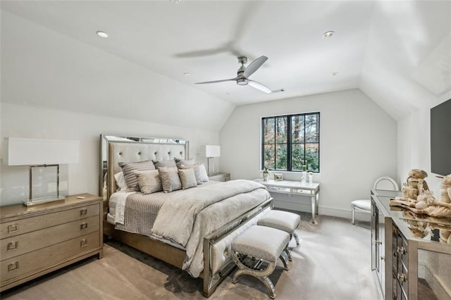 bedroom with a ceiling fan, light carpet, vaulted ceiling, and baseboards